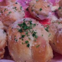 Garlic Knots · Fresh baked rolls topped with a touch of garlic oil, parmesan cheese and parsley. Once you s...