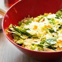 Caesar · Crisp romaine tossed with parmesan cheese, seasoned croutons and Caesar dressing. (recommend...