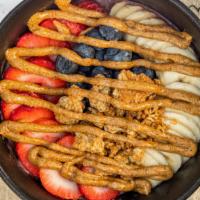 Aliya'S Acai Bowl · topped with granola, strawberries, banana, blueberries.