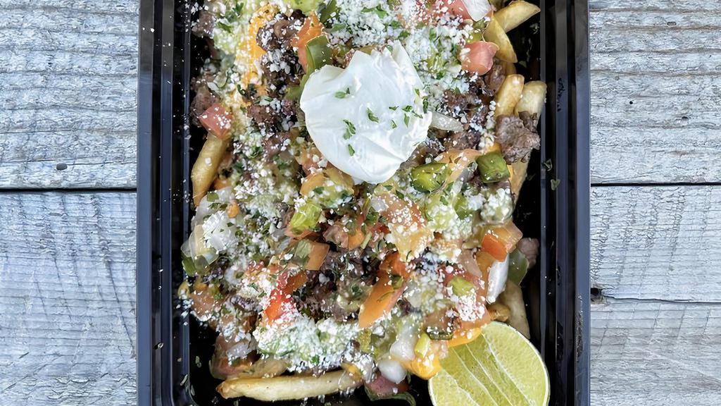 #7 Carne Asada Fries · Crispy fries with fresh grilled carne asada beef, salsa, cheese, and lime.