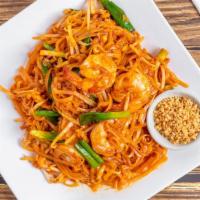 Pad Thai · Stir fried rice noodles with egg, bean sprouts, ground peanuts, and scallions. Served with f...