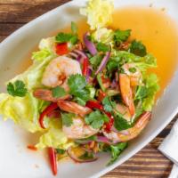 Spicy Jumping Shrimp · Marinated in lime and Thai herbs and peppers served with lettuce.