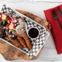 Sweet Bitch · Two thick cinnamon French toast topped with fresh berries and whipped cream or syrup and whi...