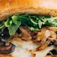Truffle Burger · Homemade bread, Angus beef,  Mozzarella Cheese,  House Mayo, Sautéed Onions, Sautéed Mushroo...