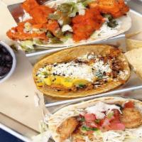3 Specialty Tacos Combo Deal · Three specialty tacos served with chips and a drink.