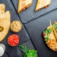 2 Tacos( Beef, Chicken, Pork Or Veggie) + Cheese Quesadilla Combo Deal · Two tacos( beef, chicken, pork or veggie) and a cheese quesadilla served with chips and a dr...