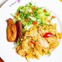 Arroz Con Pollo · Shredded chicken with yellow rice and mix-vegetables served with house salad and sweet plant...