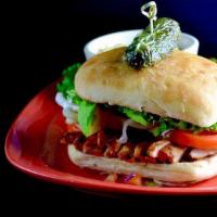Chicken Sandwich · Boneless, skinless, charbroiled Adobo chicken breast served with green leaf lettuce, tomato ...
