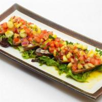 Choros A La Chalaca · Fresh mussels topped with peruvian salsa chalaca and touch of lime and aji amarillo pepper