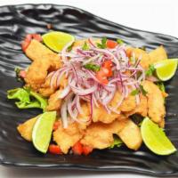 Chicharron De Pescado · Crispy fish pieces perfectly marinated, served with fried yucas, salsa criolla and tartar sa...
