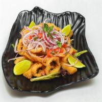 Chicharron De Calamar · Crispy calamari perfectly marinated, served with fried yucas, salsa criolla and tartar sauce.