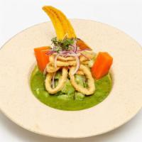 Ceviche Norteño · Chunks of fish marinated in our cilantro leche de tigre topped with fried calamari and serve...