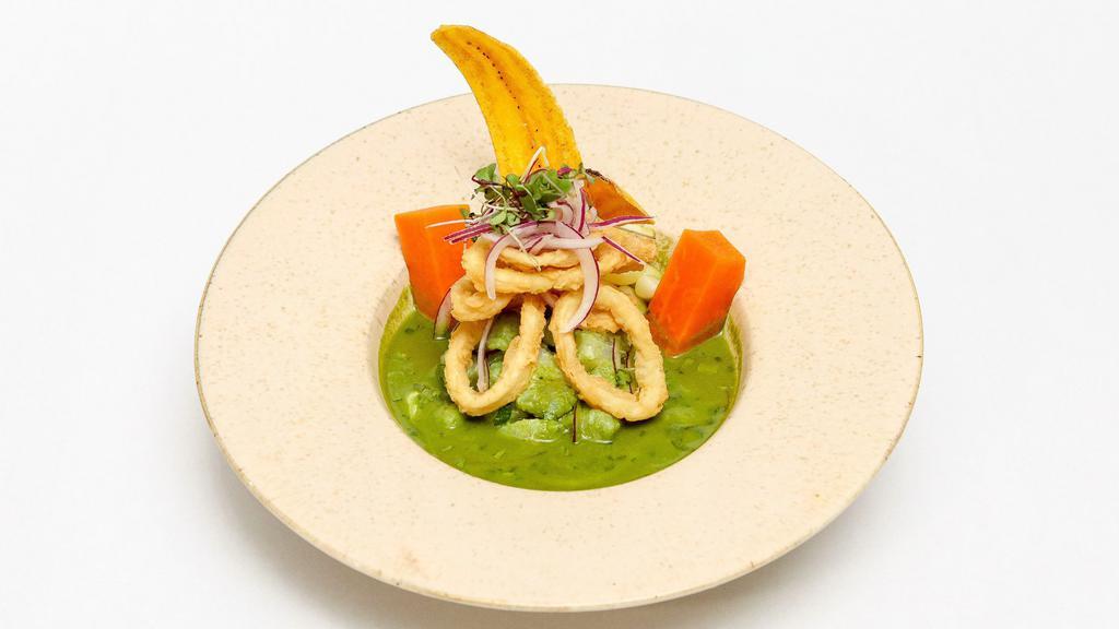 Ceviche Norteño · Chunks of fish marinated in our cilantro leche de tigre topped with fried calamari and served with sweet potatoes and corn.