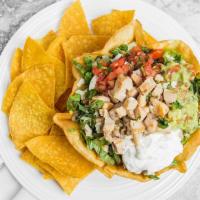 Chicken Taco Salad · Pinto beans, meat, queso, lettuce, pico salsa, sour cream and cheese all in a shell.