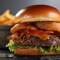 Bbq Burger · Charbroiled burger, BBQ sauce, cheddar cheese, bacon, onion rings, lettuce & tomato