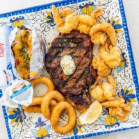 Ribeye Steak & Popcorn Shrimp · 12 oz.

These items may be cooked to order. therefore, they may or may not contain raw or un...