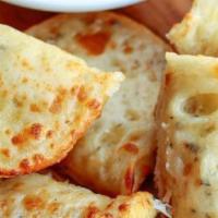 Garlic Bread With Cheese · Ciabatta Bread, Garlic Butter, and Provolone Cheese.

Baked golden brown and served with a s...