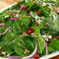Spinach Salad · Spinach, Red Onions, Gorgonzola Cheese, Red Grapes, and Sunflower Seeds. 

Served with a sid...