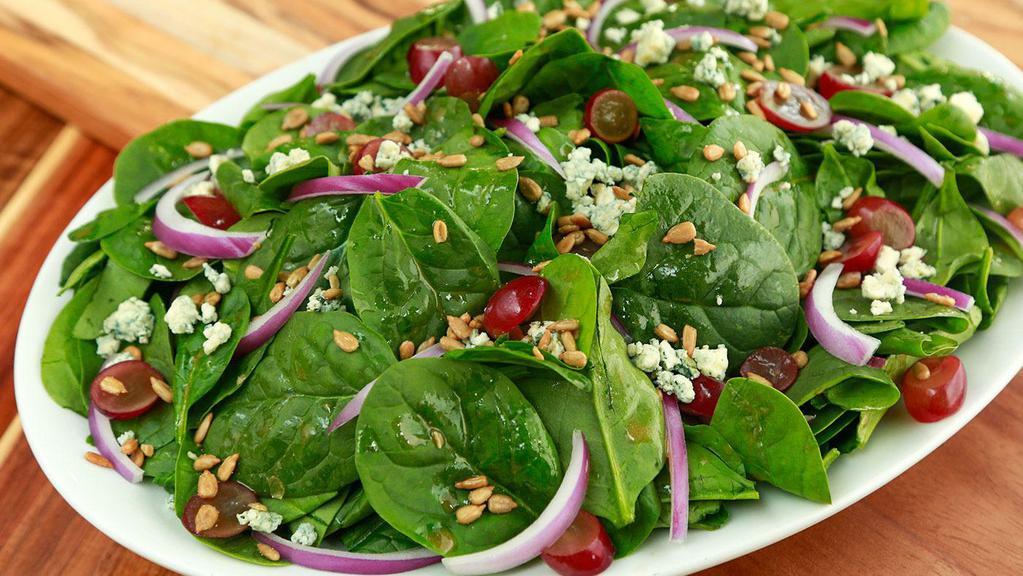 Spinach Salad · Spinach, Red Onions, Gorgonzola Cheese, Red Grapes, and Sunflower Seeds. 

Served with a side of our house-made Creamy Gorgonzola or House Vinaigrette.