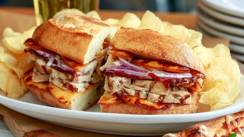 Marinated Grilled Chicken · Marinated Grilled Chicken, Smoked Gouda Cheese, Applewood Smoked Bacon, Red Onions, and our house-made Chipotle Crema.