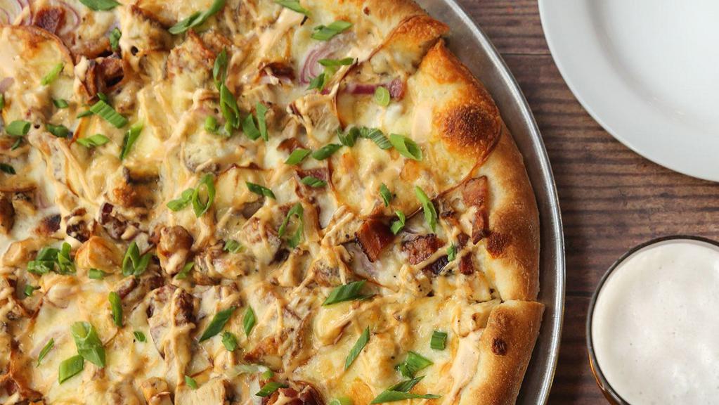 Chicken Gouda Pie · Marinated Grilled Chicken, Applewood Smoked Bacon, Smoked Gouda Cheese, Red Onions, Chipotle Crema, and Scallions.