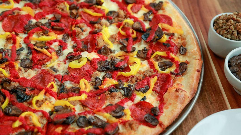 Classic Pie · Pepperoni, Sausage, Roasted Mushrooms, Banana Peppers, and our house-made Pizza Sauce.
