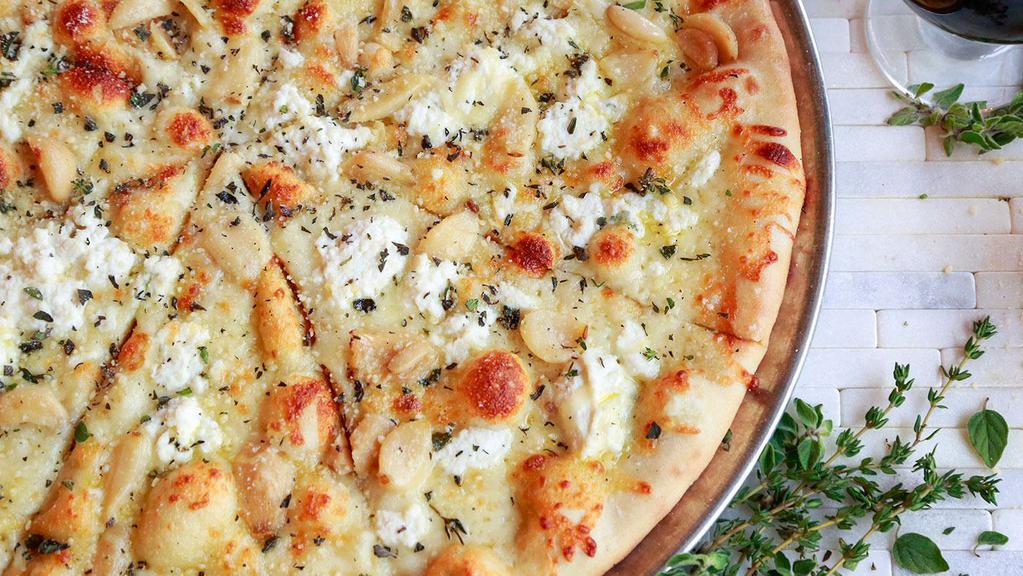 White Pie · Mozzarella Cheese, Provolone Cheese, Ricotta Cheese, Parmesan Cheese, Roasted Garlic, Olive Oil, and Fresh Herbs.