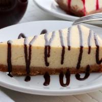 Cheesecake · House-made New York style Cheesecake with a Graham Cracker crust. 

Served with a side of Ch...