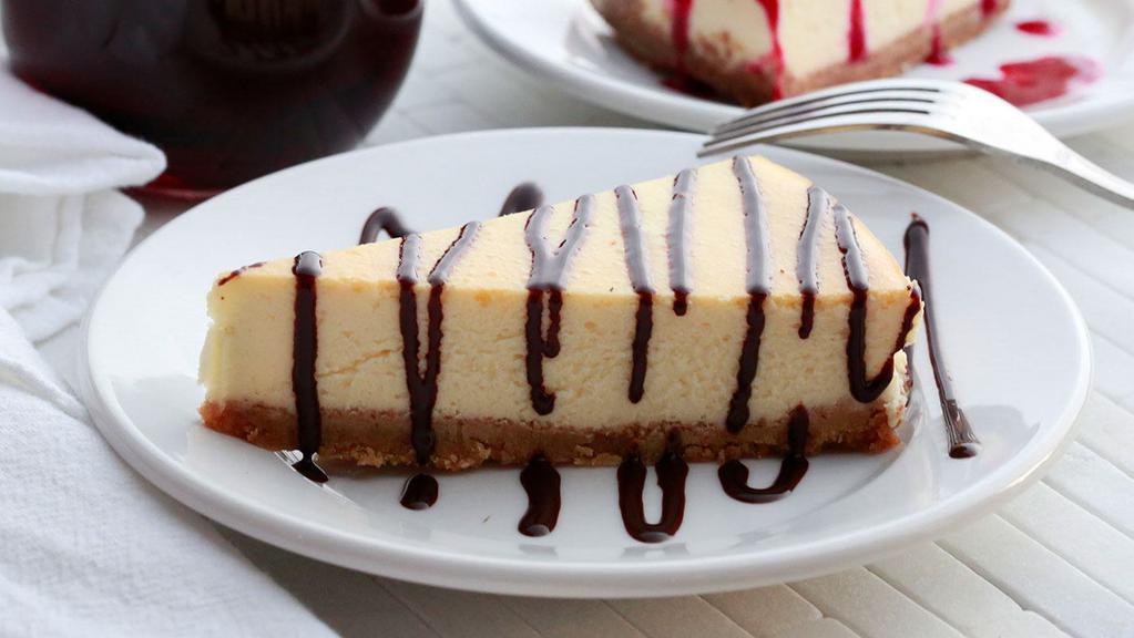 Cheesecake · House-made New York style Cheesecake with a Graham Cracker crust. 

Served with a side of Chocolate or Raspberry Sauce.