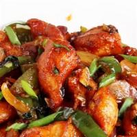 Chili Chicken · Spicy fried chicken tossed in home chilli sauce with onion and bell pepper.