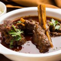 Goat Curry · Slow cooked lean baby goat meat with a blend of curry leaves, coriander, cumin and other aro...