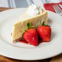 New York-Style Cheesecake · Strawberry purée, fresh strawberries, whipped cream