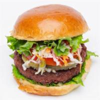 Island Spice Burger · Vegan. Grilled seasoned burger by Beyond Meat, lettuce, tomato, chopped onions, pikliz(spicy...