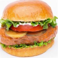 Buffalo Bomber Chickin Sandwich · Vegan. Crispy chickin tossed with spicy buffalo sauce, house-made sauce, lettuce, tomato, pi...