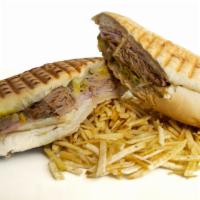 Sandwich Cubano · The classic cuban. Ham, pork, swiss cheese, steamed and hot pressed to perfection on cuban b...
