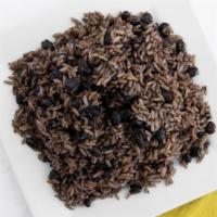 Arroz Moro · White rice and black beans, slowly cooked together.