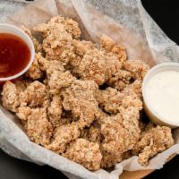 Popcorn Chicken · Flavorful marinated bite-sized chicken, perfectly fried and crisp.