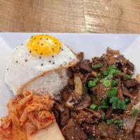 Bulgogi Beef With Rice · Beef marinated with bulgogi sauce (Korean style)
served with white rice, kimchi, and egg.