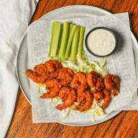 Buffalo Shrimp · Ten fried or grilled shrimp tossed in our hot sauce & served with bleu cheese & celery.