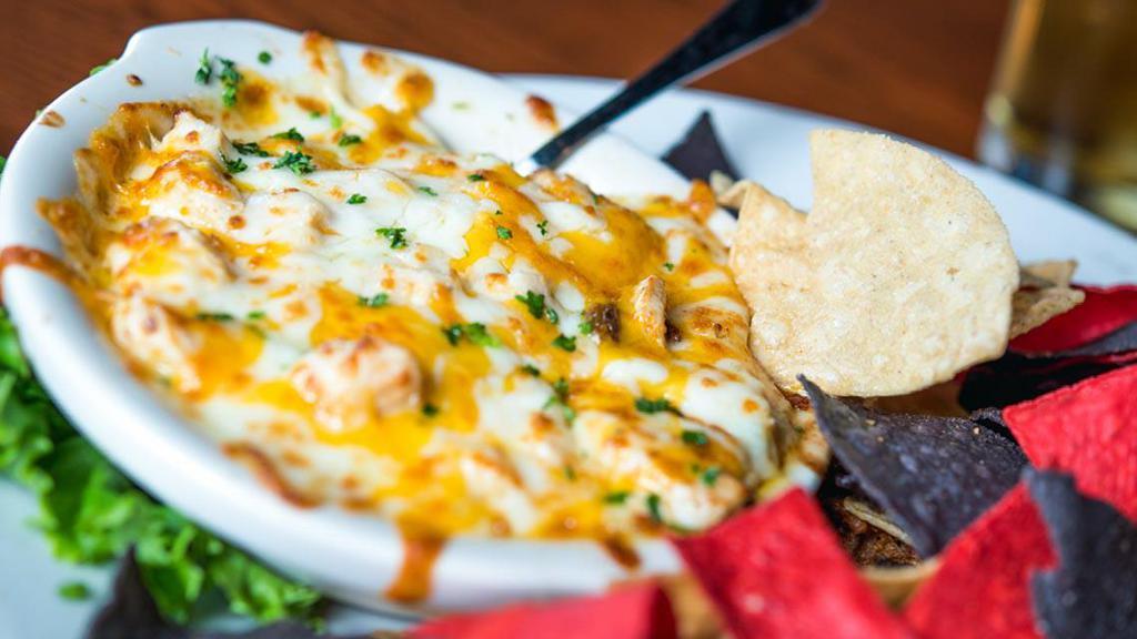 David'S Chicken & Friends · Grilled chicken in our medium sauce, bacon, shredded cheese, scallions and ranch dressing all warm and melty. Served with tortilla chips.