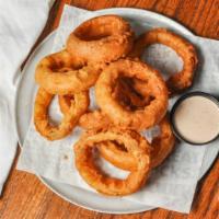 Onion Rings · Hand-dipped in our homemade spicy beer batter and served with southwest ranch.