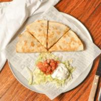 Chicken Quesadilla · Chicken, caramelized onions & roasted peppers in a cheesy, golden brown tortilla served with...