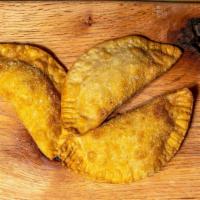 Empanada · Fried pastry stuffed with Cuban style ground beef and potatoes (Picadillo), shredded chicken...
