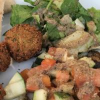 Falafel Plate · Homemade falafel balls served with hummus, tahini, fried eggplant, Israeli salad and pita br...