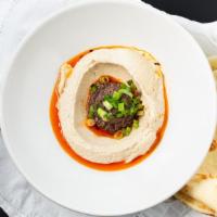 Hummus · Naan bread contains dairy. Mushroom and olive tapenade, burnt chili oil naan.