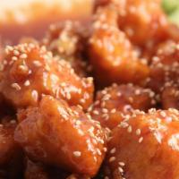 Sesame Chicken · Tender breaded chicken in our fulin's sauce topped with sesame seeds.