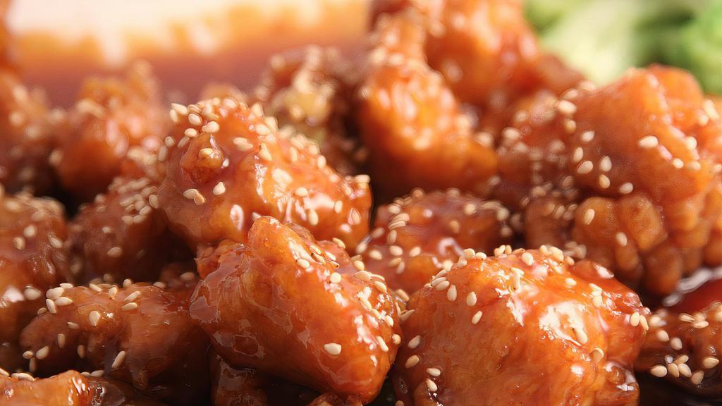 Sesame Chicken · Tender breaded chicken in sweet sauce topped with sesame seeds.