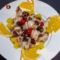 Crispy Shrimp & Honey Walnuts · Shrimp deep-fried with a sweet coconut sauce topped with honey walnuts and sprinkled with cr...
