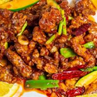 Orange Beef · Beef battered and fried, cooked with red chili sauce with stir-fried julienne bell peppers a...