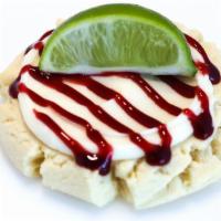 Swizzle Sugar Cookie · Coconut icing, raspberry drizzle and fresh lime.